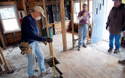 Bethel United Methodist Church site coordinator and mission volunteers from Poughkeepsie, N.Y., work inside a home damaged by Hurricane Sandy on Staten Island, N.Y. Recovery work being done by Volunteers in Mission through the New York Annual Conference, United Methodist Church. AUMNS photo by Arthur McClanahan