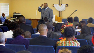 The Rev. Fred Bates brings his message to a packed Grace United Methodist Church in Arlington, Texas. Courtesy of Grace United Methodist Church.