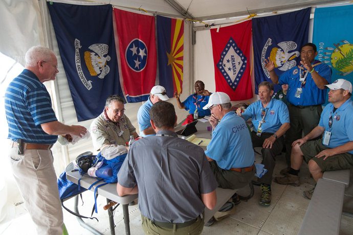 Volunteer chaplains begin their day with a staff meeting at the 2017 National Scout Jamboree at the Summit Bechtel Reserve in Glen Jean, W. Va. The United Methodist Church was the second-largest faith group represented at the event, with 3,500 professed United Methodists attending the Boy Scouts of America’s quadrennial celebration July 19-28. Photo by Mike DuBose, UMNS.
