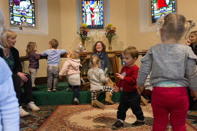 The Rev. Katy Thomas (rear) presides over a 
