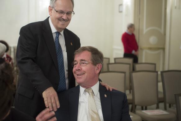 Bishop Bruce R. Ough (left) greets Bishop Scott Jones prior to the May 22 oral hearing before the United Methodist Judicial Council in Evanston, Ill. The two argued different positions before the court.