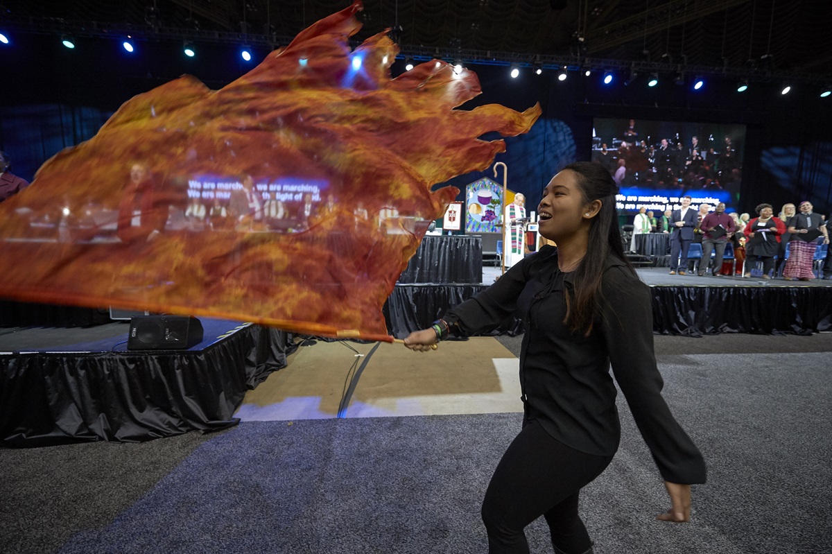 A liturgical dancer waves a flag during worship on February 24, 2019, at the Special Session of the General Conference of The United Methodist Church, held in St. Louis, Missouri. Photo by Paul Jeffrey, UMNS. A liturgical dancer waves a flag during worship on February 24, 2019, at the Special Session of the General Conference of The United Methodist Church, held in St. Louis, Missouri. Photo by Paul Jeffrey, UMNS.