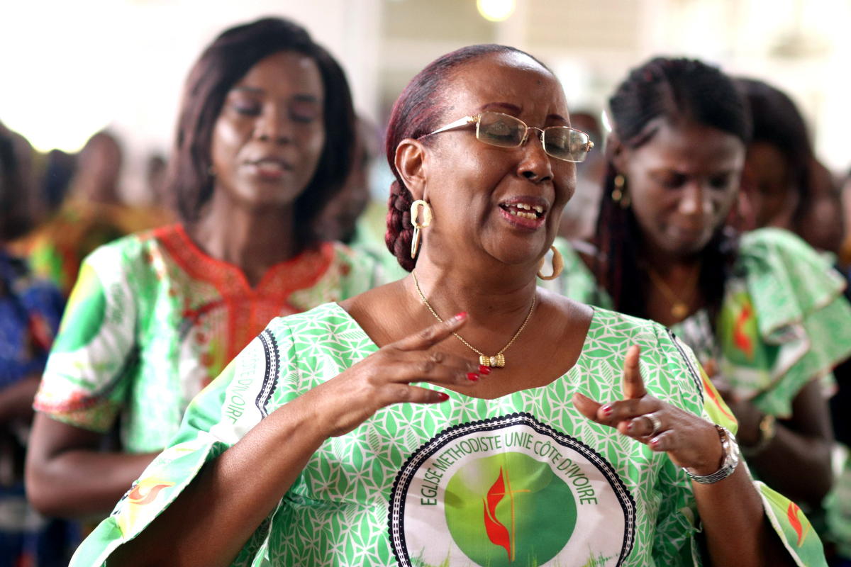 Lydie Acquah (front) joins in singing during the 10th anniversary celebration for the Voice of Hope (La Voix de l’Espérance), the radio station of The United Methodist Church in Côte d’Ivoire, at Jubilee United Methodist Church in Abidjan. Acquah is the station’s director. Photo by Isaac Broune, UM News.