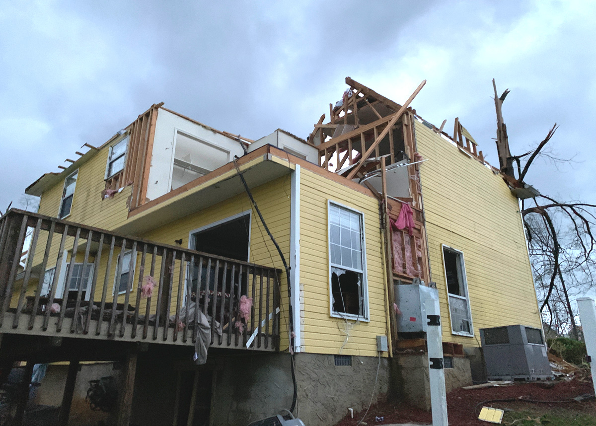 The Farleys, members of First-Centenary United Methodist Church in Chattanooga, Tenn., posted “messages of distress” to their Facebook page after severe storms devastated their home on April 12. Troy Hamilton, youth pastor at the church, drove and then walked to reach them: "It was glorious to have a familiar friendly face show up.” Photo by Troy Hamilton.