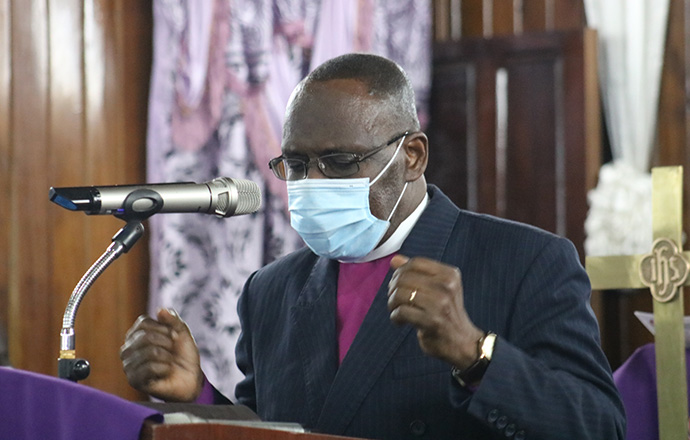 Bishop Benjamen Boni, Côte d'Ivoire, leads a moment of prayer during the Sept. 5 funeral vigil for Sierra Leone Area Bishop John K. Yambasu held at King Memorial United Methodist Church in Freetown, Sierra Leone. Photo by E Julu Swen, UM News.