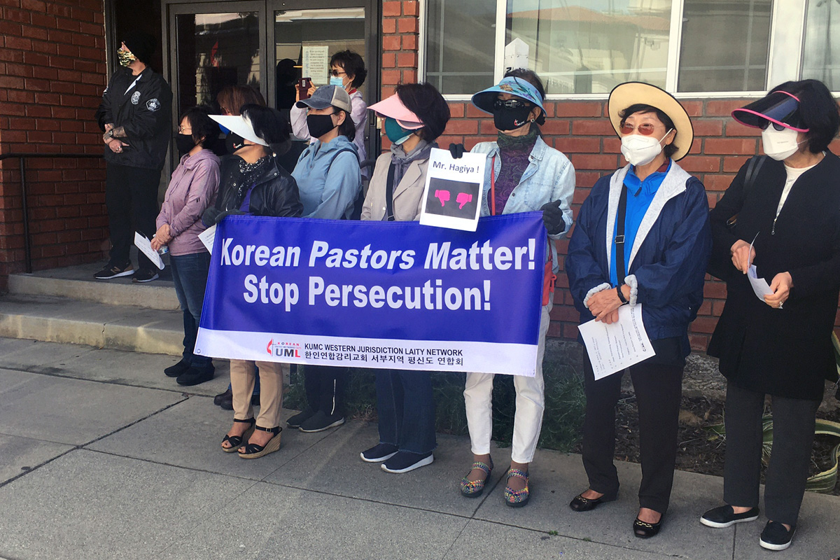 Korean American United Methodists and others stage a demonstration outside the California-Pacific Conference office in Pasadena, Calif., on May 21. The group was protesting Bishop Grant Hagiya’s decision to move three Korean American pastors from the churches they’ve been serving. Photo by Ted Smith III.