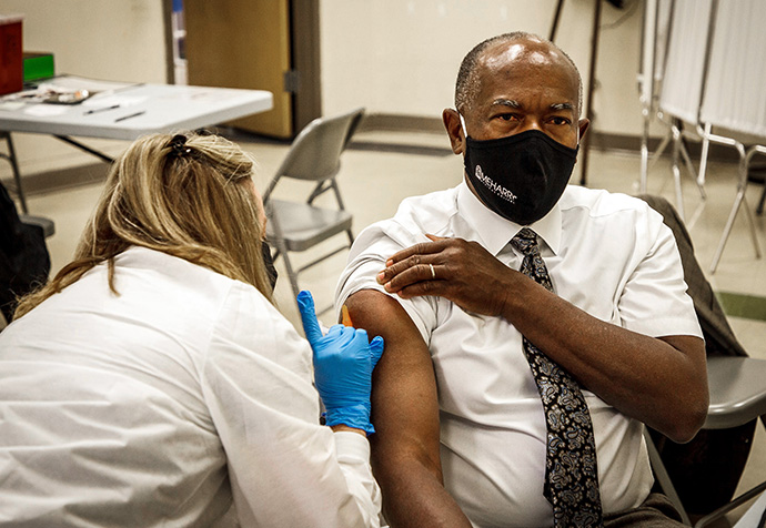 Dr. James Hildreth, president of Meharry Medical College in Nashville, Tenn., receives a COVID-19 vaccination at a city-run clinic in December 2020. Hildreth said in news reports at the time that he received the vaccine on camera in order to demonstrate his confidence in its safety. Photo courtesy of Meharry Medical College.