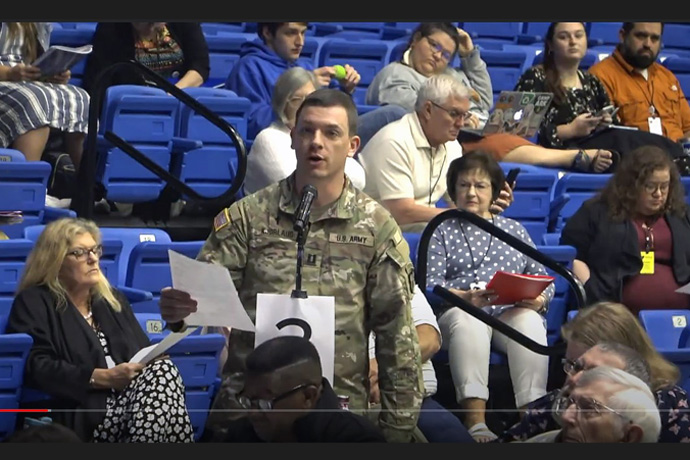 The Rev. Andrew C. Kjorlaug, an Arkansas Conference elder and U.S. Army chaplain, presents a resolution at the Arkansas Annual Conference that calls on the state’s congressional delegation to act on “Responsible Fire-Arm legislation.” In a year that has seen multiple mass shootings, Arkansas was among a number of United Methodist conferences urging elected leaders to do more to regulate guns. Screengrab courtesy of the Arkansas Conference via YouTube by UM News.