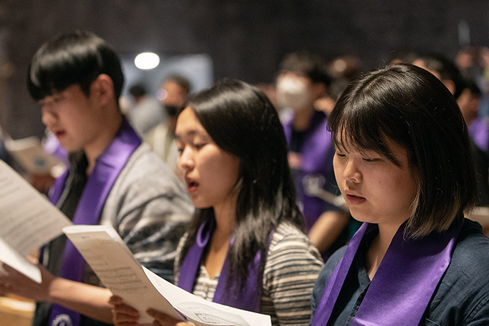 Participants pray during a service for peace and reunification between South and North Korea at St. Stephan Church in Karlsruhe, Germany, as part of the World Council of Churches' 11th Assembly. Photo by Mike DuBose, UM News.