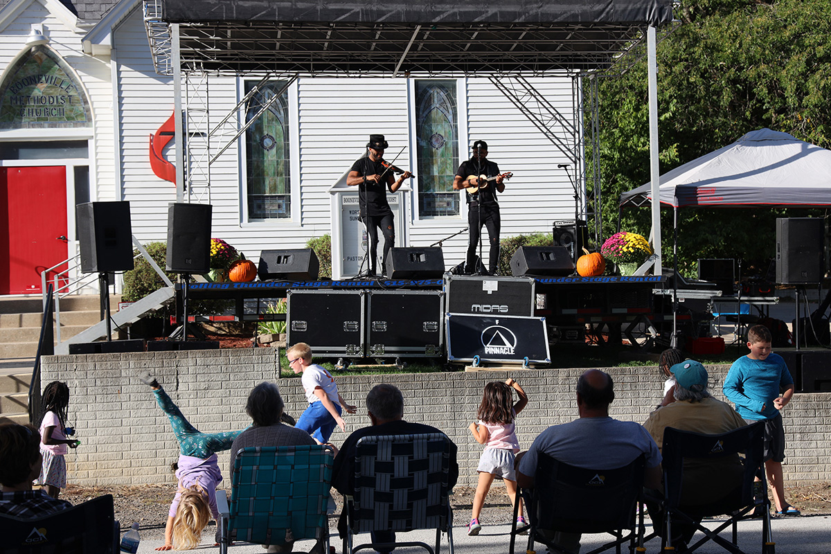 Children dance in front of the stage at Booneville (Iowa) United Methodist Church’s annual music festival. What began as a small way for Booneville United Methodist Church to reach out to the community has blossomed into an annual event attracting hundreds. Photo by Courtney Levin, Iowa Conference. 