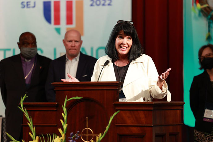 Newly elected Bishop Connie Shelton thanks the delegates of the Southeastern Jurisdictional Conference after her election Nov. 2. Shelton, a district superintendent in the Mississippi Conference, was elected on the 12th ballot with 213 votes. Her husband, the Rev. Joey Shelton, stands behind her. The Southeastern Jurisdictional delegates are meeting Nov. 2-4 in Lake Junaluska, N.C. Photo by Ben Smith, UM News.