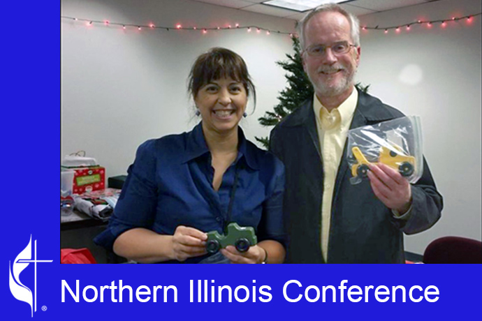 "Kids Above All" Vice President of Resource Development Zulma Colon (left) poses with the late Rev. Doug Williams in 2017. The Rev. Doug Williams, who died in 2019, brought the idea of making and distributing toy wooden cars to his congregation at Aldersgate United Methodist Church in Rockford, Ill., in 2011 as a new ministry to children. Photo courtesy of the Northern Illinois Conference.