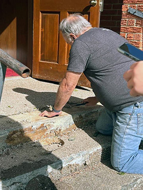 A member of Market Street United Methodist Church fixes the stairs of the building of the former Eustace United Methodist Church in Eustace, Texas. Getting the building into shape after it was vacant for three years has taken a lot of work. The new Market Street congregation is currently worshipping in the Eustace building with permission of the neighboring Texas Conference but has plans to be in nearby Mabank, a growing community where the fellowship first got together. Photo courtesy of the Rev. Eston Williams.