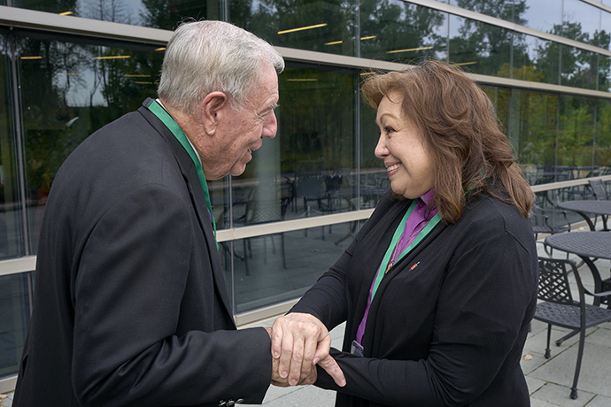 Retired United Methodist Bishop Alfred W. Gwinn speaks with Bishop Minerva G. Carcaño after she was found not guilty by a jury of her peers on Sept. 22, the fourth day of a church trial in Glenview, Ill. The jury decision was unanimous on all four charges against her. Gwinn served as the presiding officer, the equivalent of a judge, in the trial. Photo by Paul Jeffrey, UM News.