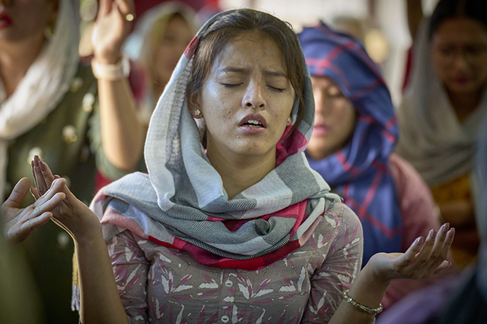 A woman prays during worship at Hebron United Methodist Church in Lalitpur, Nepal, on May 20. Christians comprise only about 1.4 percent of Nepal’s 30 million people. Over 80 percent of the population is Hindu. The remainder are mostly Buddhist and Muslim. Photo by Paul Jeffrey, UM News.