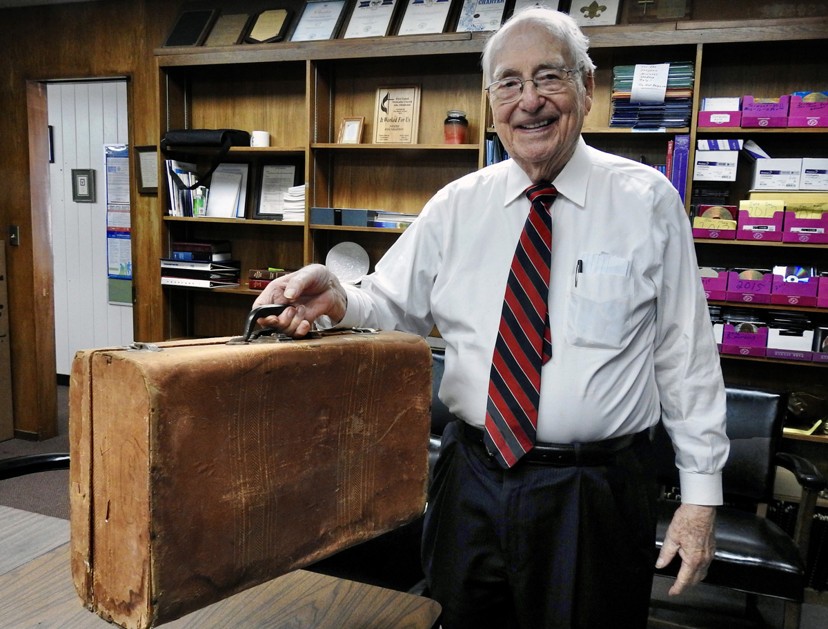 The Rev. Roberto Escamilla shows the suitcase he carried when traveling from Mexico to Iowa at age 17, to attend Parsons College. Escamilla would go on to a long, distinguished career in United Methodist ministry, and became an interpreter and traveling companion for famed Methodist missionary evangelist E. Stanley Jones. Photo by Sam Hodges, UM News.