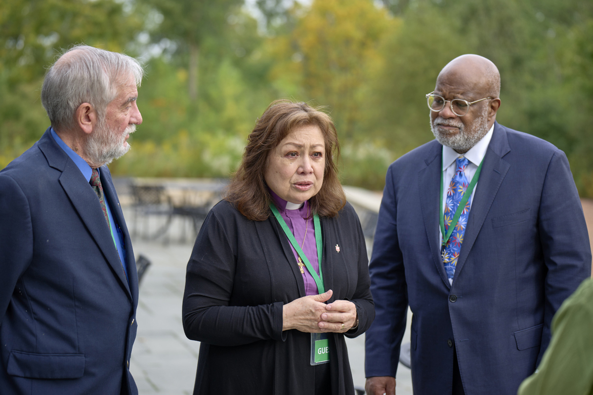 United Methodist Bishop Minerva G. Carcaño speaks to the press in Glenview, Ill., on Sept. 22, 2023, following a jury’s unanimous verdict of not guilty in her church trial. She is accompanied by her counsel in the trial: the Rev. Scott Campbell (left) and Judge Jon Gray. Carcaño is now reinstated after an 18-month suspension, but questions remain about what comes next. Photo by Paul Jeffrey, UM News.