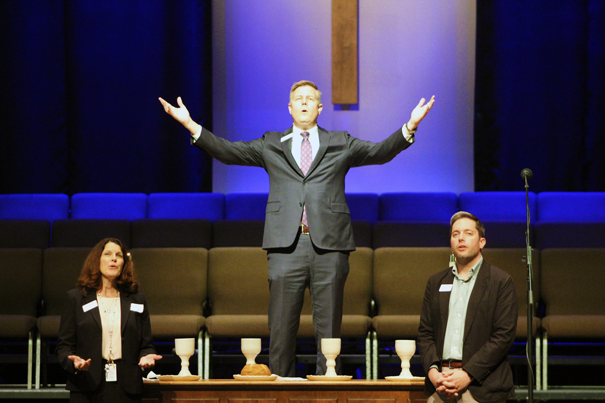 The Rev. Bryan Brooks (center), senior pastor of Franklin First United Methodist Church, prepares for Holy Communion at the close of “Building Community with Older Adults,” a workshop hosted by ENCORE Ministry Oct. 26 at the church in Franklin, Tenn. The event was hosted in partnership with the University of Tennessee Chattanooga’s School of Nursing. Photo by Vernon Jordan, UM News.