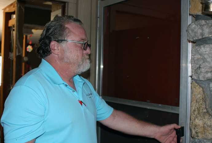 Shane Vaughn, now 54, was released from prison for the fourth time on Feb. 19, 2003. Here he is 20 years later, on Nov. 28, 2023, opening the door to Apartment 2 at Exodus House in Oklahoma City, where he lived for six months after he was released from prison. “This was the door of opportunity for me,” says Vaughn. “What I experienced here taught me how to live." Photo by Boyce Bowdon, UM News.