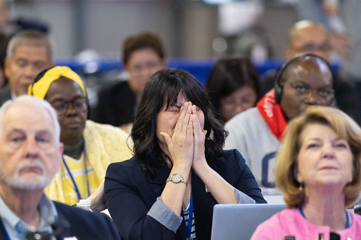 The Rev. Karen Jones of the South Carolina Conference reacts to the passage of legislation during the United Methodist General Conference, meeting in Charlotte, N.C., that will allow deacons to preside over Holy Communion in their ministry context. Photo by Mike DuBose, UM News.