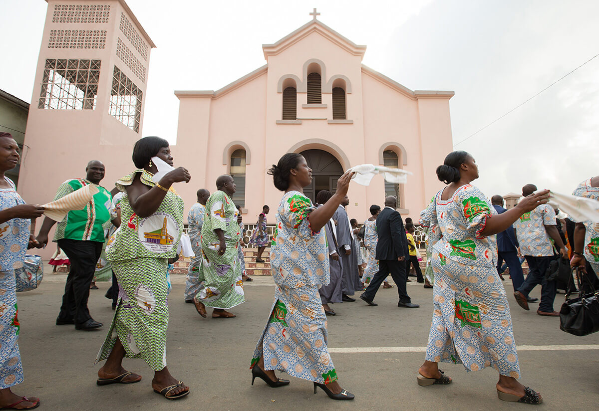 Church members walk in a parade to greet visitors at Temple Bethel United Methodist Church in the Abobo-Baoule neighborhood of Abidjan, Côte d'Ivoire, in 2015. The Côte d'Ivoire Conference voted May 28 to leave The United Methodist Church, but it has not left yet. File photo by Mike DuBose, UM News.