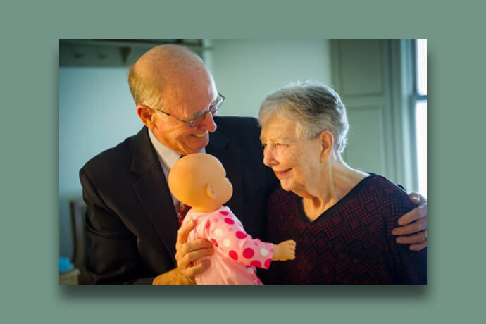 Bishop Kenneth Carder hugs wife Linda at Bethany memory care unit, part of the Heritage at Lowman senior community near Columbia, S.C. Linda passed away in 2019. 2016 file photo by Matt Brodie.