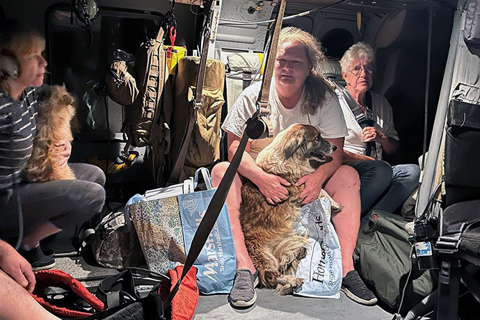 Tennessee National Guard soldiers from the 1-230th Assault Helicopter Battalion airlift citizens in East Tennessee affected by Hurricane Helene to safety in a Black Hawk helicopter on Sept. 28. Photo by Staff Sgt. Jacob Hancock, U.S. Air National Guard, courtesy of the Tennessee National Guard.