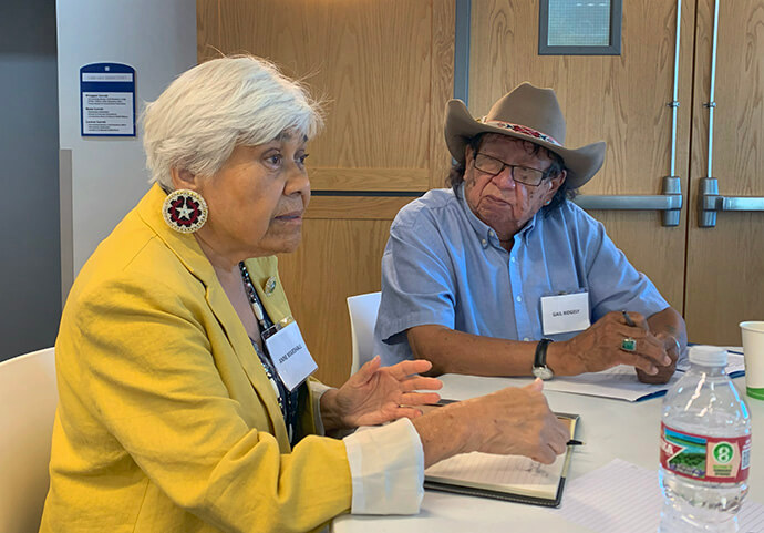 The Rev. Anne Marshall of the Oklahoma Indian Missionary Conference (left) and Gail Ridgely, a Sand Creek representative of the Northern Arapaho tribe, take part in a table discussion during a Sept. 20-21 meeting of the United Methodist Responses to the Sand Creek Massacre Team. The group of church leaders and tribal representatives are formulating next steps in the denomination’s work to atone for its role in the 1864 Sand Creek Massacre. Photo by Joey Butler, UM News.