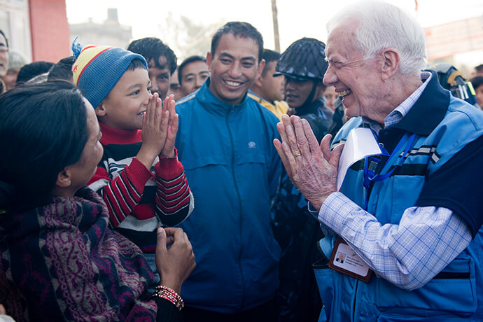 Jimmy Carter greets a young Nepali boy with the customary Namaste gesture during The Carter Center’s observation of Nepal’s constituent assembly elections in November 2013. Photo courtesy of The Carter Center.