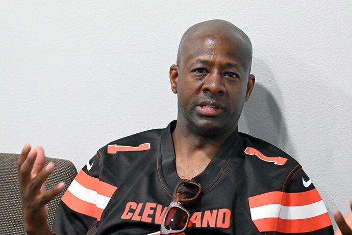Jason Shelton talks at his church, The Village United Methodist Church in DeSoto, Texas, on Oct. 27. He is wearing a Cleveland Browns jersey for the tailgate party-worship service held that day in the church parking lot. Photo by Jim Patterson, UM News.