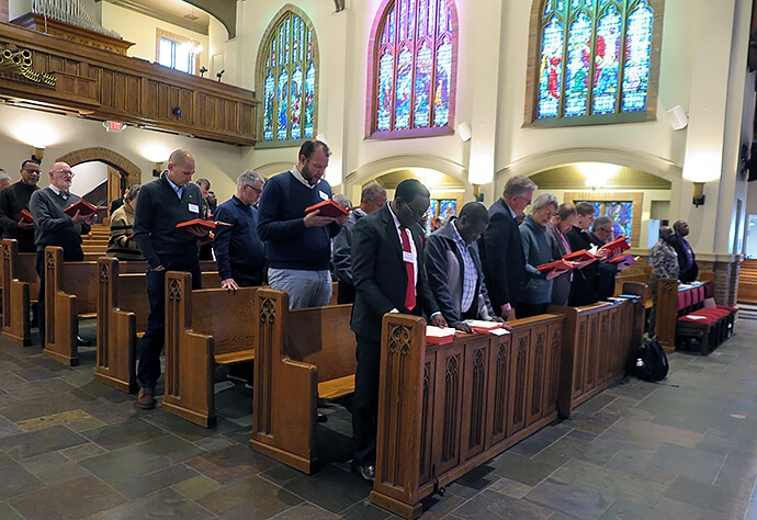 Members of the Standing Committee on Central Conference Matters join in opening worship in the sanctuary shared by the United Methodist Board of Global Ministries and Cascade United Methodist Church’s Midtown campus in Atlanta. The standing committee, a permanent committee of General Conference, met Jan. 26-29 in Atlanta to begin its work for the next four years. Photo by Heather Hahn, UM News.