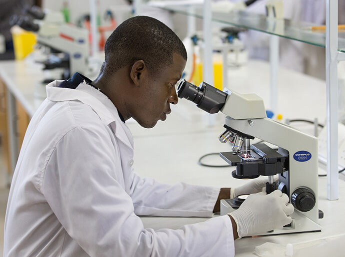 A student works in a science lab at Africa University in Mutare, Zimbabwe, in 2017. File photo by Mike DuBose, UM News.