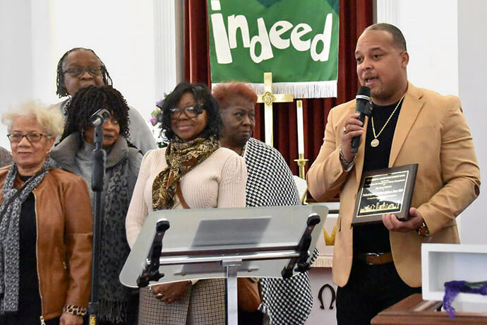 The Rev. William Brawner, pastor of Mother African Zoar United Methodist Church, thanks the Eastern Pennsylvania Conference for the 2024 Herbert E. Palmer Urban Ministry Award, presented in recognition of the church’s revitalized ministry. He stands alongside members of the congregation, some of whom traveled more than 90 minutes to show their support. File photo by John Coleman, UM News.
