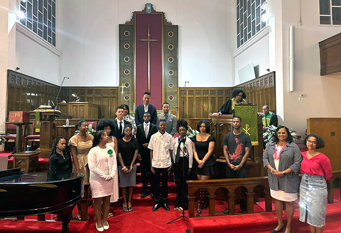 Students pose for a photo in the sanctuary of Asbury United Methodist Church in Washington during Graduate and Student Recognition Sunday in June 2024. File photo courtesy of Asbury United Methodist Church.