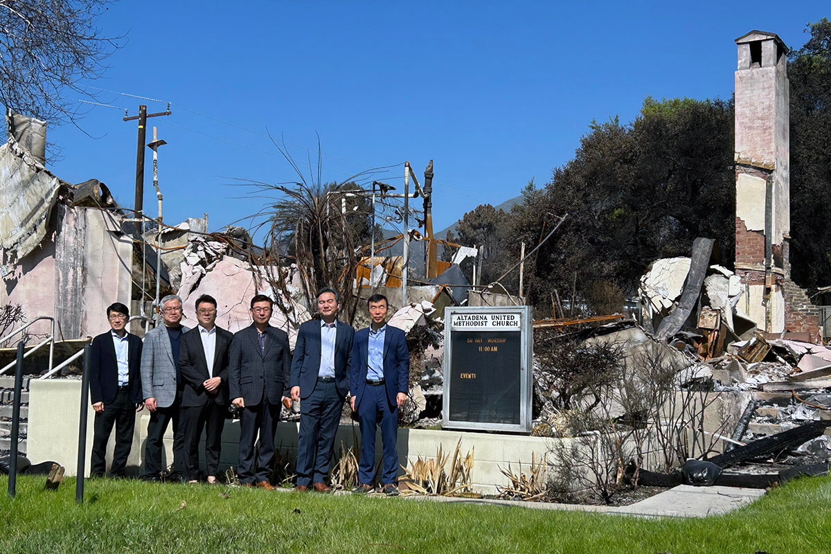 Leaders with the Association of the Korean United Methodist Church of the California-Pacific Conference visit and pray at Altadena United Methodist Church on Feb. 24. The historic African American church in Altadena, California, was destroyed by wildfire in January. Photo by the Rev. Thomas E. Kim, UM News. 