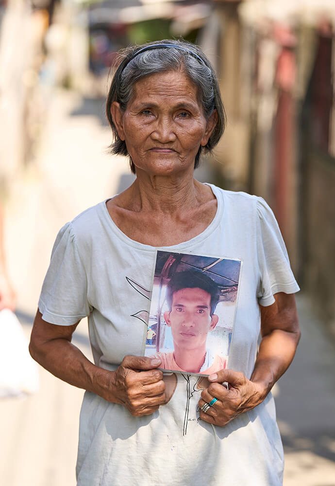 Estrella Nonay holds a photo of her son Bernardo, who was assassinated in 2018 in Caloocan, Philippines, as part of the government's so-called "war on drugs." Since her son's killing, Nonay has become an active member of Rise Up for Life and for Rights, a coalition of victims’ families and advocates that was co-founded by United Methodist deaconesses. Photo by Paul Jeffrey, UM News.