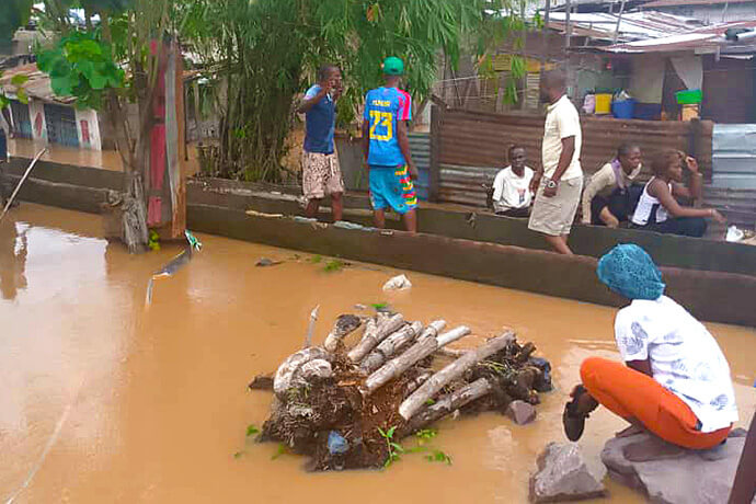 Residents navigate floodwaters by canoe in Kinshasa, Congo. Flooding on April 5 damaged church members’ homes and two United Methodist churches. Photo by the Rev. Fiston Okito, UM News.