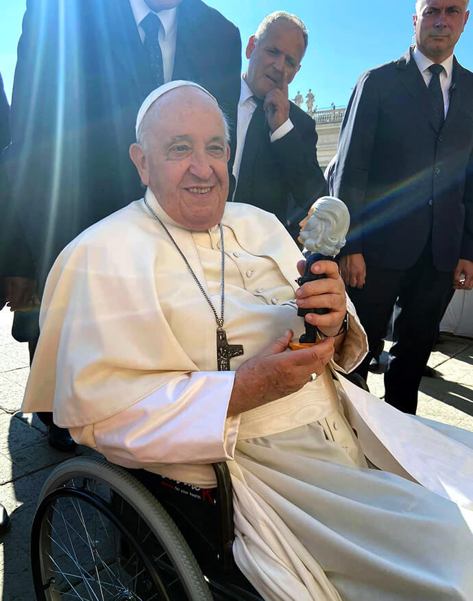Pope Francis holds the John Wesley bobblehead given to him by Ashley Boggan, top executive of the United Methodist Commission on Archives and History, during the pope’s general audience on Sept. 6, 2023, at St. Peter’s Square in Vatican City. File photo courtesy of the Methodist Ecumenical Office Rome.