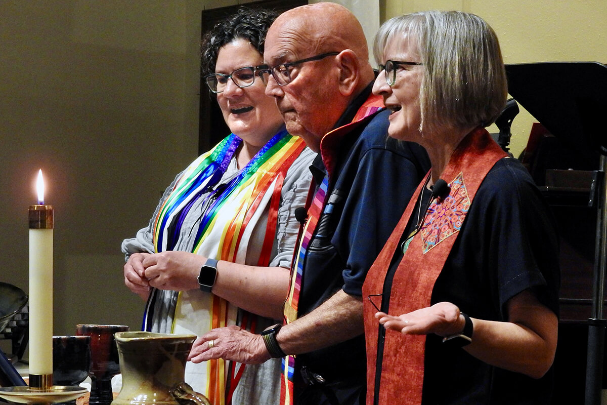 Reinstated clergy members the Revs. Beth Stroud (left), Deen Thompson and Susan Morgan serve communion at a May 1 celebration of full inclusion for LGBTQ persons in The United Methodist Church. The event was at Dallas’ Greenland Hills United Methodist Church. Photo by Sam Hodges, UM News.