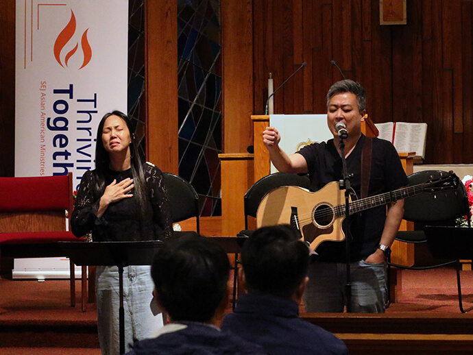 The Revs. Daniel (right) and Isaiah Park lead the praise team and prayer during the inaugural Southeastern Jurisdiction Asian American Ministers Gathering, held May 13-15 at the Korean United Methodist Church of Greater Washington in McLean, Va. The Parks are pastors at Restoration Church in Reston, Va. Photo by the Rev. Thomas E. Kim, UM News.