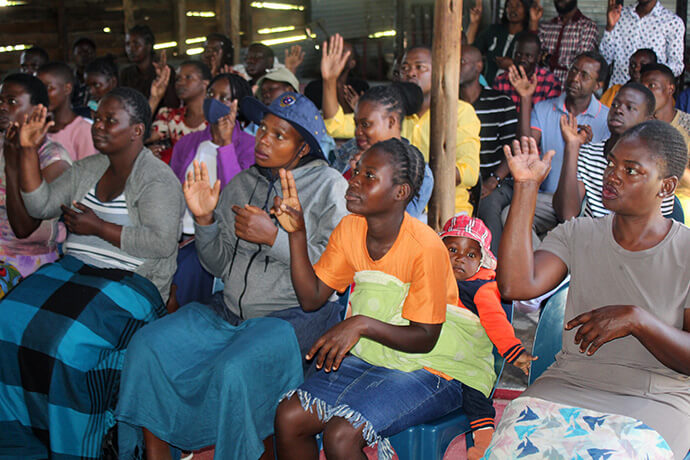The Sunday Class at King Solomon United Methodist Church practices sign language during a Christian education session led by missionary Collins Kwasi Prempeh last month. Photo by Kudzai Chingwe, UM News.