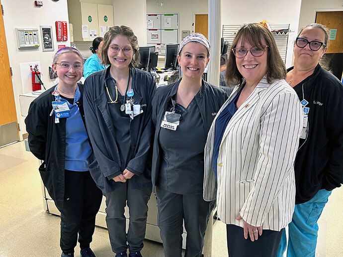 Bishop Lanette Plambeck (second from right), resident bishop for the Dakotas-Minnesota Area, poses with some of the medical staff at Geisinger Medical Center in Danville, Pa., who cared for the Rev. Dr. Richard Huskey in his final days. Huskey, a United Methodist and advocate for LGBTQ rights, died June 15. Photo by Cindy Weaver, courtesy of the Minnesota Conference.