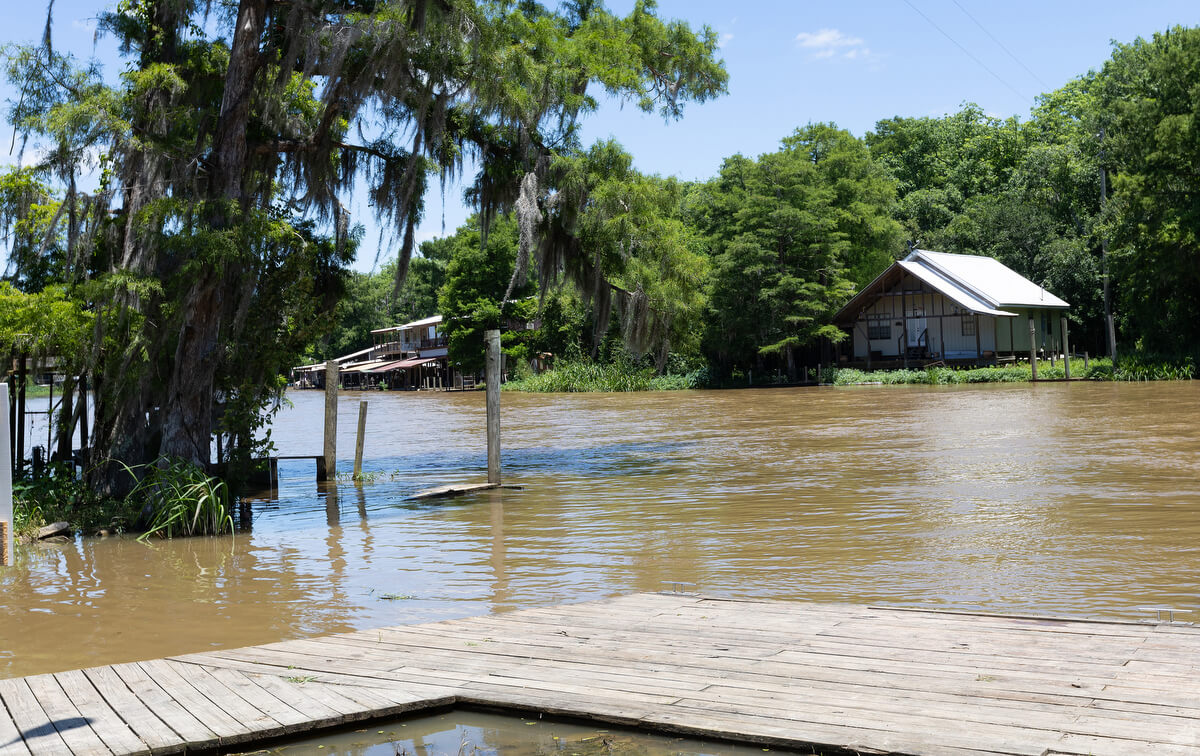 The Old Pearl River runs peacefully beside the Indian Village boat ramp in Slidell, La., in 2025. In 2005 water from the river and nearby Lake Pontchartrain were pushed by storm surge from Hurricane Katrina into Slidell, flooding many homes and businesses.