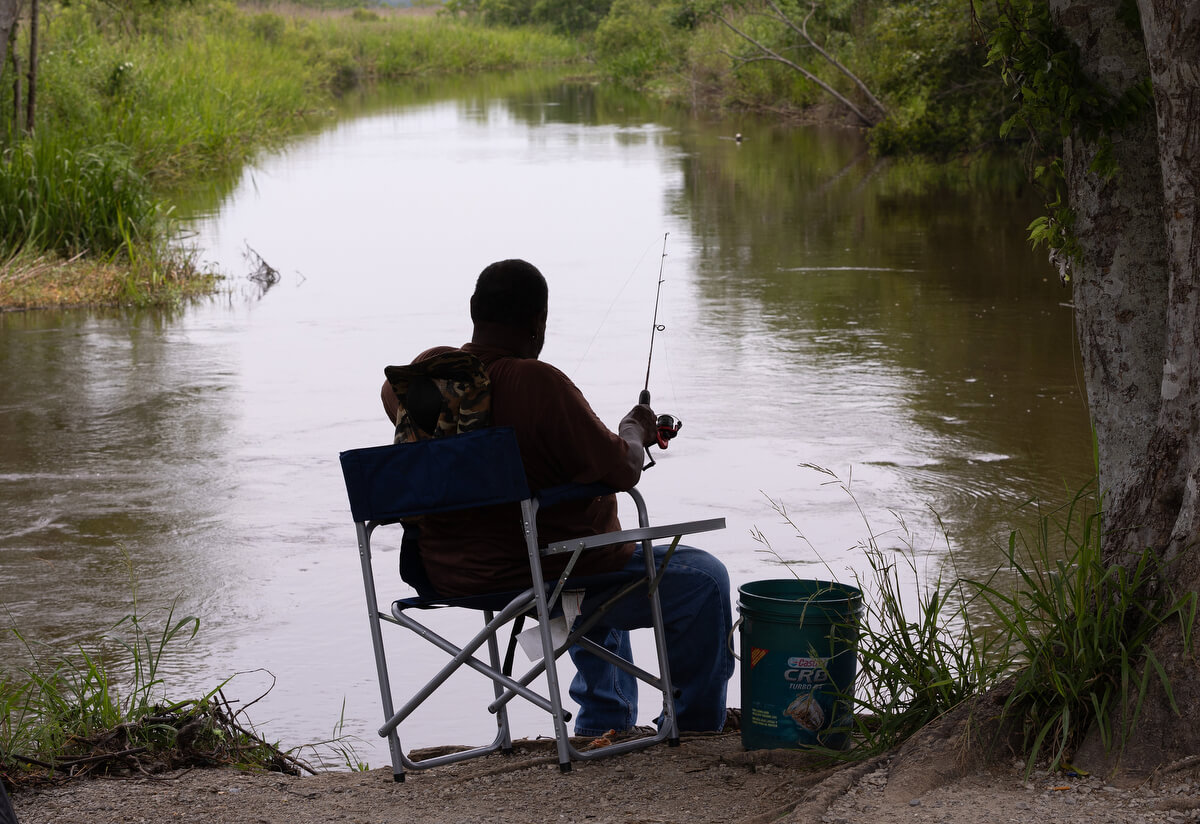 A fisherman enjoys the tranquil waters of the Big Branch Marsh National Wildlife Refuge on Salt Bayou, near Slidell, La. During Hurricane Katrina in 2005, storm surge from Lake Pontchartrain, nearby bayous and rivers caused devastating flooding.