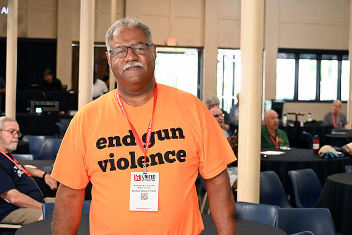 Bishop Julius C. Trimble, top executive of the United Methodist Board of Church and Society, displays his desire to end gun violence Aug. 2 during the National Men’s and Scouting Ministry Gathering in St. Simons Island, Ga. Trimble led a workshop on social justice during the conference. Photo by Jim Patterson, UM News.