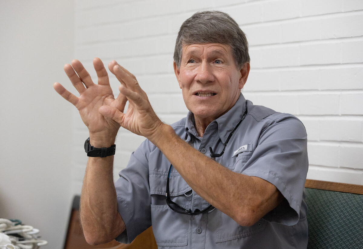 Church member Gary Uhl describes efforts to rebuild St. Luke’s United Methodist Church after Hurricane Katrina flooded the sanctuary. Photo by Mike DuBose, UM News.