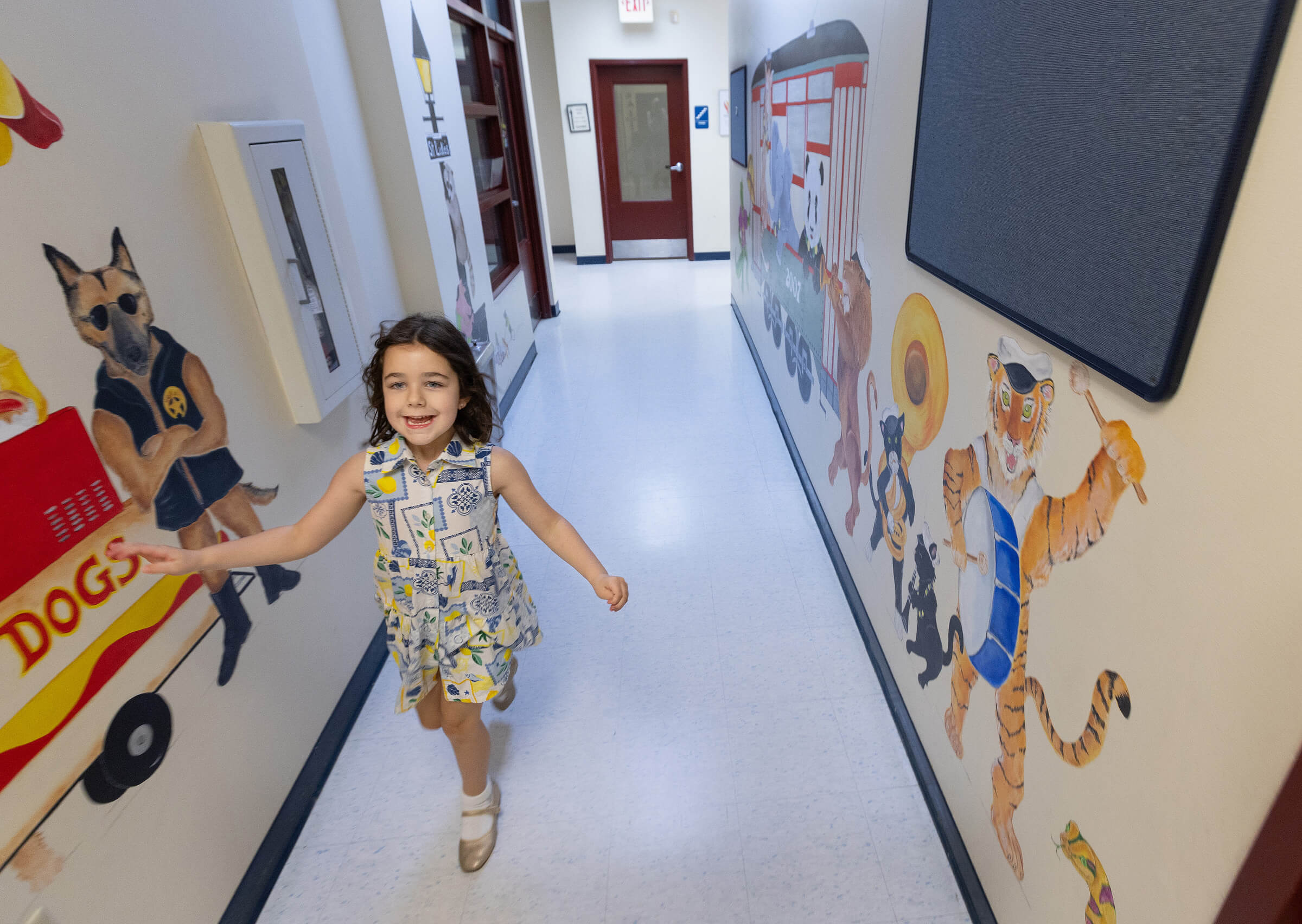 Margot Murrell runs gleefully down the childcare hallway at St. Luke’s United Methodist Church in July 2025. Photo by Mike DuBose, UM News.