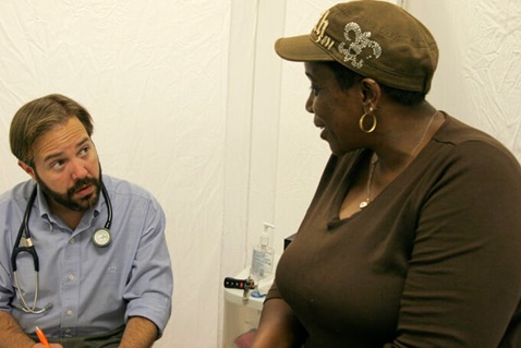 Sharon Young talks with Dr. Brent Wallas at Luke's House, a free medical clinic held every Tuesday evening in Mount Zion United Methodist Church. UMNS photos by Kathy L. Gilbert.