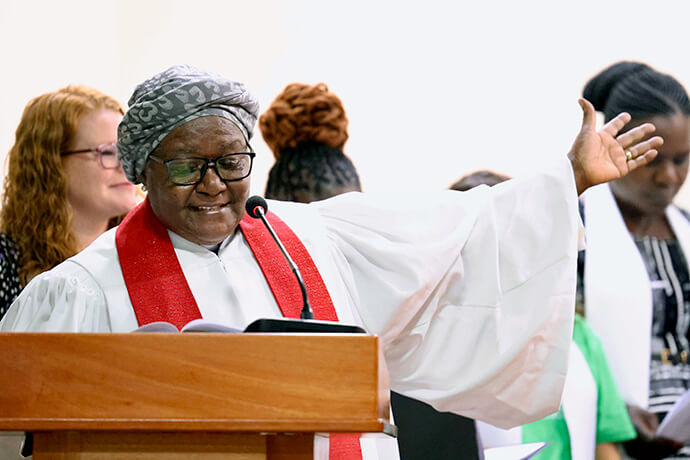 Retired Bishop Joaquina F. Nhanala offers a blessing and formally presents the newly consecrated deaconesses and home missioners to be received by the diaconal members present on behalf of The United Methodist Church in Moshi, Tanzania. Fifteen candidates were consecrated during the service. Photo courtesy of Laurel Akin.