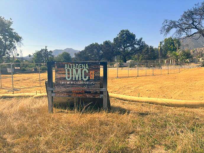 A temporary Altadena United Methodist Church sign claims the now-cleared land where the church once stood. The family- and youth-focused church emphasizes its Scripture-based theme, “Home of the Abundant Life,” especially when inspiring support for its rebuilding efforts. Photo courtesy of Heather Wilson.